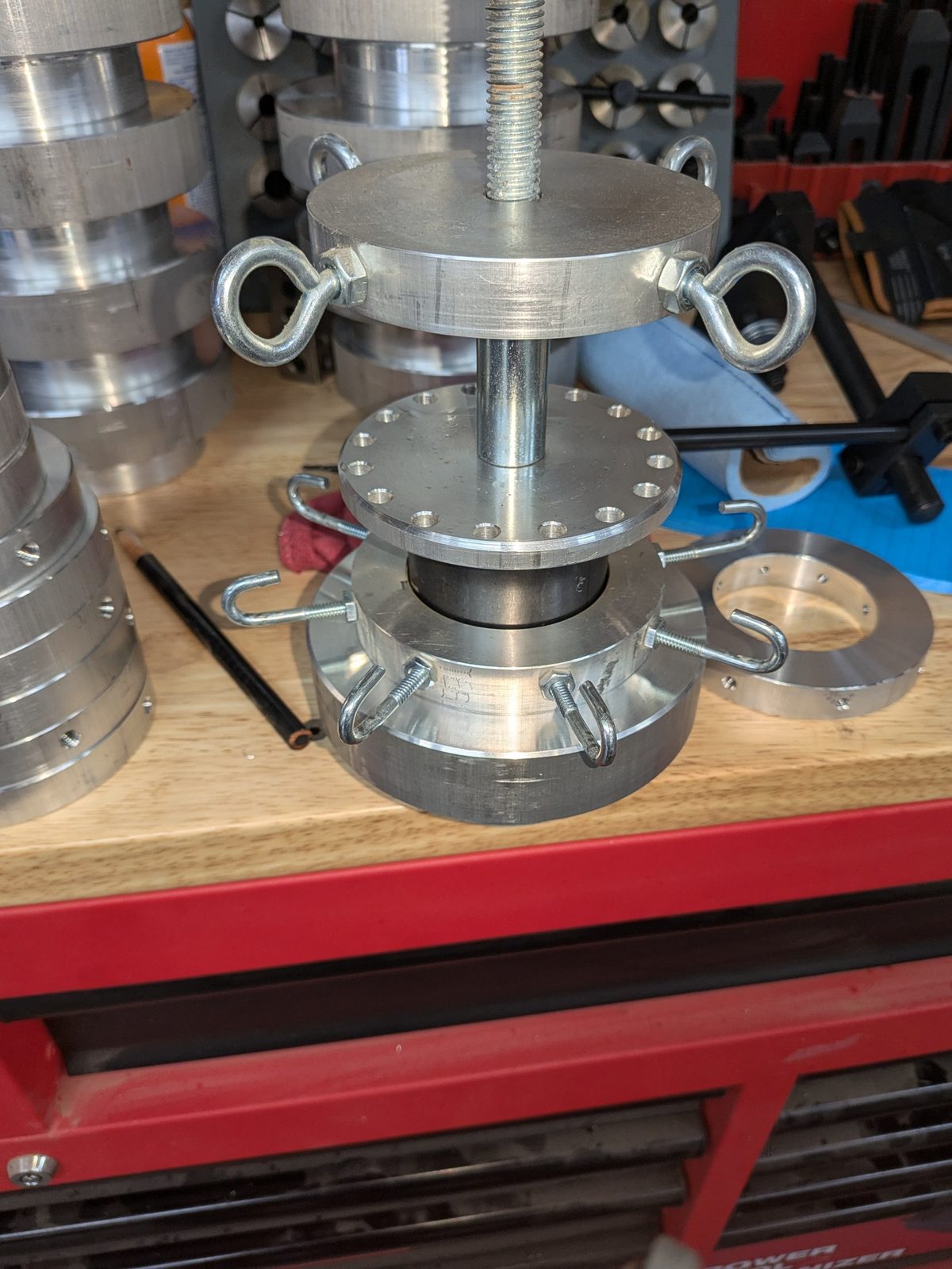 Raising adapter with hooks and eye bolts