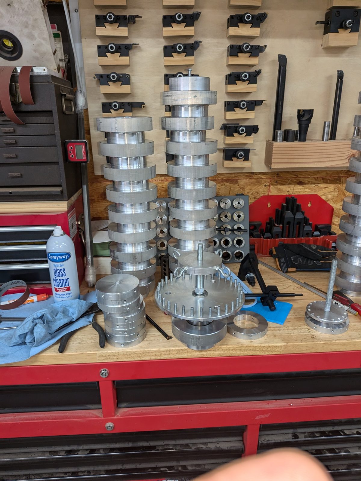Stacks of lathe-turned flanges, sorted by size
