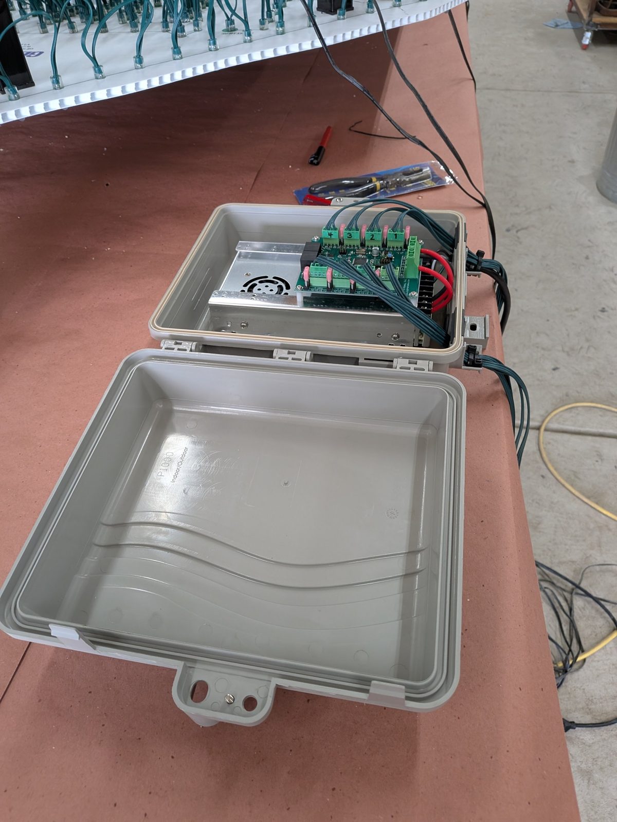 A controller box, lid open, mid-wire
